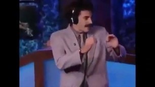 Borat kisses Howard Sterns penis with pants.